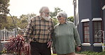 Talk, walk and old couple in yard with love, relationship and bonding at nursing home together. Outdoor, pensioner and elderly people in retirement to relax with care, support or conversation on date