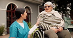 Backyard, nurse and talking to old woman in wheelchair for medical advice, fresh air or bonding. Healthcare, caregiver or senior person at nursing home for rehabilitation, trust or retirement support
