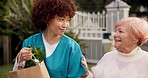 Walking, nurse and help with old woman and grocery for support, occupational therapy and trust. Healthcare, nutritionist advisor and caregiver with people in nursing home for retirement and kindness