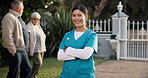Happy woman, face or nurse with confidence at retirement home for assisted living or health service. Portrait, female person or caregiver with smile or arms crossed at facility for elderly care