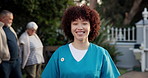 Nurse, woman and outdoor with face at retirement home, happy and uniform with pride for career. Person, caregiver and portrait with smile for elderly care services, job and senior people in garden