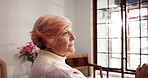 Anxiety, depression and regret with senior woman in retirement home for memories or nostalgia. Idea, relax and thinking with lonely old person in bedroom of apartment for contemplation or frustration