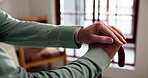 Hands, senior person and walking stick in home for balance with injury recovery, rest and relax. Elderly patient with disability, cane and mobility aid for rehabilitation, arthritis or osteoporosis