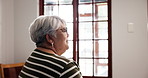 Depression, regret and sad with senior woman in retirement home for memories or nostalgia. Alone, relax and thinking with unhappy elderly person in apartment for contemplation or mental health