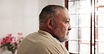 Alone, anxiety and regret with senior man in retirement home for memories or nostalgia. Depression, relax and thinking with unhappy old person in bedroom of apartment for contemplation or frustration