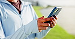 Woman, hands and browsing with phone in nature for fitness, workout routine or schedule. Active, female person or research with mobile smartphone for exercise tips, health and wellness on ocean coast
