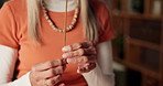 Incense sticks, smoke and mature woman in living room for ambience, peace and relax in home. Calm, smile and aroma therapy with fragrance for female person in lounge with apartment, smell and zen