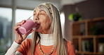 Woman, happy and drinking smoothie in home for breakfast shake, healthy diet or wellness benefits. Nutritionist, mature person or smile with protein drink for meal replacement, digestion or nutrition