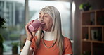 Woman, face and drinking smoothie in home for breakfast shake, healthy diet or wellness benefits. Nutritionist, mature person and happy with protein drink for meal replacement, digestion or nutrition