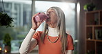 Woman, nutrition and drinking smoothie in home for breakfast shake, healthy diet or health benefits. Morning, mature person and happy with protein drink for meal replacement, digestion and vitamins