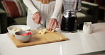 Hands, smoothie and cut banana in home for breakfast shake, healthy diet and wellness benefits. Blender, person and prepare ingredients for protein drink, meal replacement recipe and detox beverage