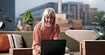 Laptop, mature woman and remote work for shipping, logistics and order update for delivery. Package, computer and happy freelancer in home for stock procurement, sales and distribution for ecommerce
