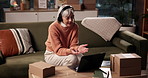 Headset, remote work and woman on laptop for video conference, customer support and advice. Home, courier service and person talking with packages for online discussion, client help and consulting