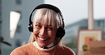 Mature, happy woman and consultant with headset for virtual assistance or online advice in home. Female person, agent and remote work with mic for communication, help or customer service in house