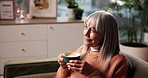 Senior woman, drinking and thinking with coffee for morning beverage, aroma or caffeine on sofa. Elderly, female person and contemplating with mug in wonder or thought for memory or nostalgia in home