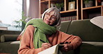 Senior woman, writer and thinking with book in home for story, copywriting or journalism. Elderly, female person or author in contemplation with novel for fantasy, imagination or literature in house