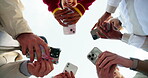 Hands, phone and social media with friends on sky together for mobile networking from below. App, huddle and text message with group of people outdoor for contact, information or internet search