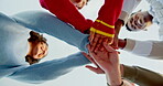 Hands, huddle and motivation with friends on blue sky together for solidarity or support from below. Community, stack and team building with group of excited people outdoor in nature for success