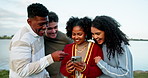 Laughing, phone and social media with friends outdoor together for connectivity or networking. App, mobile search and text message with group of funny people in nature for comedy, humor or meme