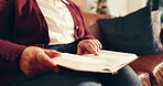 Hands, senior person and reading bible to worship, spiritual faith and connection to God. Elderly woman, prayer and holy scripture for guidance, testament and religious belief in Jesus Christ in home