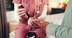 Nurse, hands and senior person with blood test for diabetes, elderly care and advice in home. Woman, caregiver and pensioner for healthcare, insulin check and medical monitor for exam and service