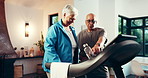 Senior couple, treadmill and fitness in home, walk and support talk with training partner in retirement. Elderly woman, man and point with gym equipment, smile and motivation with exercise at house