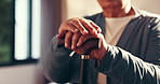 Hands, walking stick and senior man in home for healing, balance or arthritis recovery. Rehabilitation, wood cane and elderly male person with a disability for mobility aid, help or assistance.