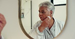 Senior woman, cotton or bathroom with mirror for skincare, facial treatment or grooming in home. Happy, elderly or female person with smile or reflection for beauty or anti aging in retirement house