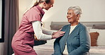 Happy women, nurse or dressing with elderly patient on bed for assisted living in retirement home. Female people, caregiver and clothing with senior care for comfort, support or help in old age house