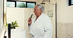 Comb, singing and senior woman in bathroom with music for getting ready in morning at home. Dancing, fun and elderly female person with playlist, song or radio by mirror for beauty routine in house.