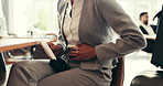Menstrual pad, pain and hands of woman in lobby with period ache in abdomen, ibs or travel medical emergency. Healthcare, business person and work trip with constipation, digestion or stomach cramps