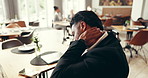 Businessman, neck pain and stress in cafe with burnout, anxiety or overworked on work trip. Male person, tired or frustrated with travel, overtime or fatigue in restaurant for meeting with strain