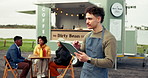 Coffee truck, small business and man with tablet for sales, order stock or inventory outdoor. Barista, person and technology at mobile cafe to review menu, scroll email or thinking of hospitality