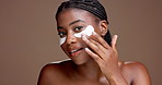 Girl, eye patch and face with beauty in studio for dark circles, cosmetics or hydration on background. African woman, smile and portrait with space for dermatology, skincare and results in Nigeria