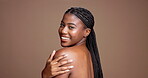 Shoulder, skincare and smile with face of black woman in studio for beauty, body care and hygiene. Glow, dermatology and shine with female model on brown background for mockup space and grooming