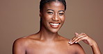 Skincare, beauty and smile with face of black woman in studio for aesthetic, self care and hygiene. Glow, dermatology and shine with female model on brown background for grooming and moisturizing