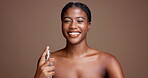Happy, woman and spray for smell, face and fresh scent with fragrance, studio background or perfume. Mockup space, self care and black person with cosmetics for bodycare, confident and grooming