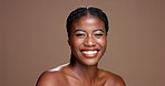 Beauty, skincare and laugh with face of black woman in studio for dermatology, grooming and self care. Glow, happiness and comic with person on brown background for collagen, hydration and space
