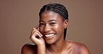 Smile, beauty and hands with face of black woman in studio for skincare, glow and dermatology. Shine, hydration and grooming with person on brown background for self care, cleaning and detox