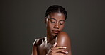 Black woman, skincare and natural glow in studio with healthy skin, cosmetic care and wellness. Smooth, beauty and shine with bodycare treatment, mockup space and dermatology on grey background