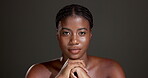 Beauty, skincare and serious with face of black woman in studio for glow, dermatology and self care. Mockup space, hydration and aesthetic with female model on dark background for shine and grooming
