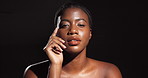 Beauty, face and woman with glow in studio from hydration treatment, healthy skin or glowing. Mockup, skincare and african girl with results of dermatology routine and self care on black background