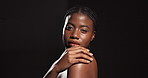 Beauty, face and woman with body care in studio with natural glow, healthy skin and hydration. Mockup space, clean and african girl with confidence for cosmetics treatment results on black background