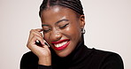 Smile, lipstick and face of black woman in studio with makeup, cosmetics and salon products. Mockup space, aesthetic and portrait of person with lip gloss, shine and beauty on white background