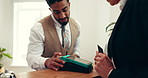 Hands, hotel or customer with credit card payment for booking, hospitality or accommodation. Fintech, concierge service or people at help desk with machine for contactless transaction or check in