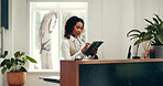 Receptionist, scroll or woman with tablet in hotel for booking upgrade, checkin app or availability. Hospitality, concierge and digital tech at front desk for reservation management or online request
