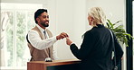 Mature woman, keys and hotel reception man with smile, registration documents or accommodation. People, paperwork and sign with concierge, happy client and welcome for hospitality on business trip