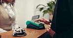 Hands, booking or customer with credit card for hotel reception, payment or accommodation. Client, concierge service or people at help desk with machine for guest, fintech transaction or check in