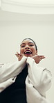 Face, excited woman and dancing in office for celebration, good news and bonus success. Happiness, low angle or female employee in workplace with career opportunity, smile or professional achievement
