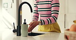 Water, soap and woman washing hands in house for hygiene, self care or wellness in kitchen. Faucet, health and female person cleaning skin for protection of dirt, bacteria or germs in apartment.
